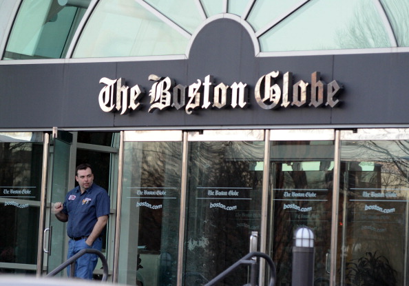 Man in front of Boston Globe