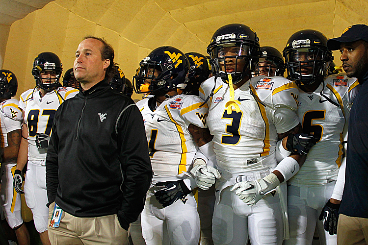 Dana Holgorsen's (left in jacket) Mountaineers will compete in the Big 12 in 2012. (Mike Ehrmann/Getty Images)