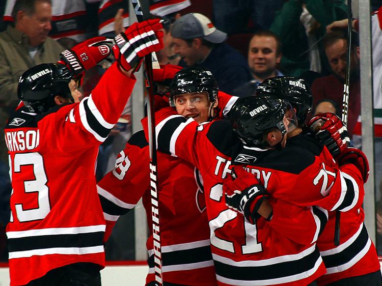 LIGHTING IT UP: After a sluggish start, the New Jersey Devils roared back to defeat the Atlanta Thrashers Tuesday night at the Prudential Center. (Bruce Bennett/Getty Images)