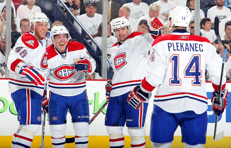 MONTREAL MOVES ON: Michael Cammalleri (second from left) celebrates the game-winning goal. (Dave Sandford/Getty Images)