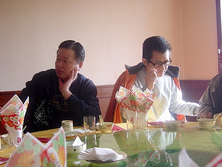 Chinese human rights lawyers Gao Zhisheng (L) and Guo Feixiong pictured in a restaurant in January 2006. (The Epoch Times)