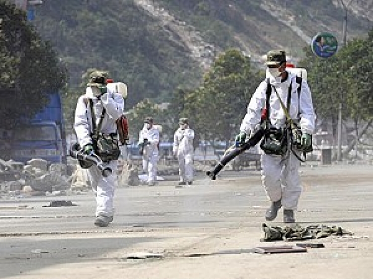 Soldiers disinfect the streets of the worst earthquake-hit area of Beichuan county, in China's southwestern province of Sichuan on June 25, 2008 the final day local residents have been allowed to recover their belongings from the devastated city.  (Liu Jin/AFP/Getty Images)