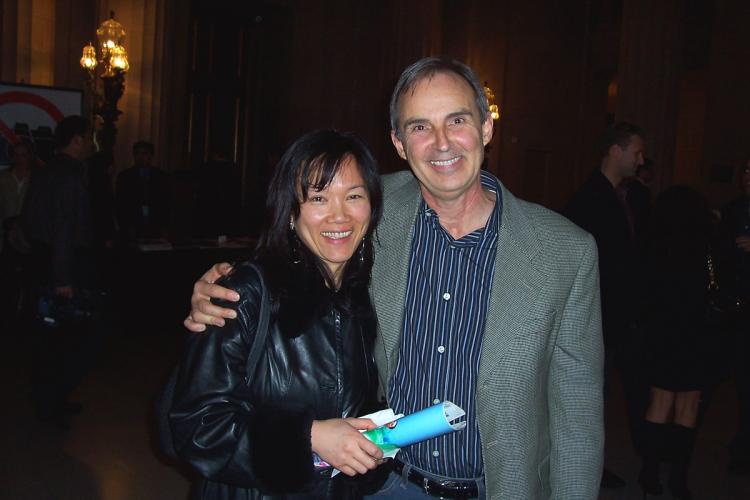 Composer Mr. Michaud and his wife enjoy the Divine Performing Arts show. (Gerry Wang/The Epoch Times)