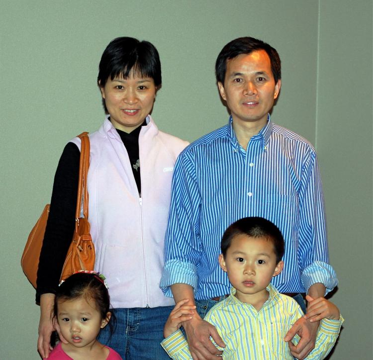 Mr. Hong with his family at the Von Braun Center Hall in Huntsville. (Mary Silver/The Epoch Times)