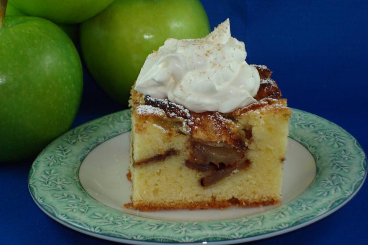 Harvest apple cake served warm with whipped cream. (Sandra Shields/The Epoch Times)