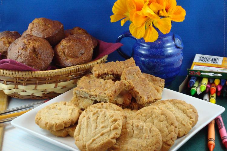 Banana nut muffins (left), crispy coconut pecan snaps, (centre) and melt-in-your-mouth peanut butter cookies (front).