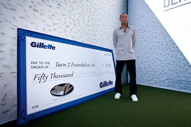 THANK YOU: New York Yankees Captain Derek Jeter accepts a huge thank-you card and a $50,000 donation from Gillette. (Amal Chen/The Epoch Times)
