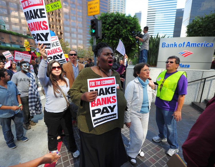 Protesters demonstrate against corporate greed, home foreclosures, and joblessness in downtown Los Angeles on Oct. 6. The Occupy Wall Street protests that began in New York on Sept. 17 are now spreading to other countries, including Canada. (Robyn Beck/AFP/Getty Images) Protesters demonstrate against corporate greed, home foreclosures, and joblessness in downtown Los Angeles on Oct. 6. The Occupy Wall Street protests that began in New York on Sept. 17 are now spreading to other countries, including Canada. (Robyn Beck/AFP/Getty Images)