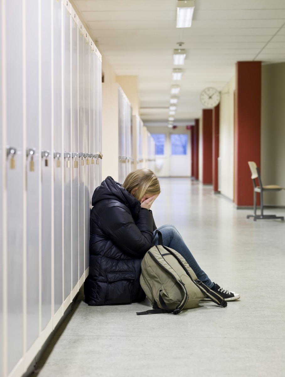 Young woman getting bullied at school