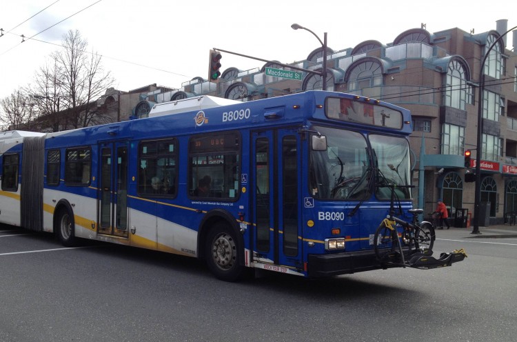 A TransLink bus travels along Broadway at MacDonald in Vancouver.