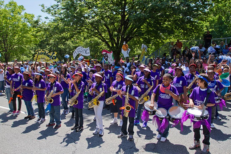 A marching band from the program Education Through Music