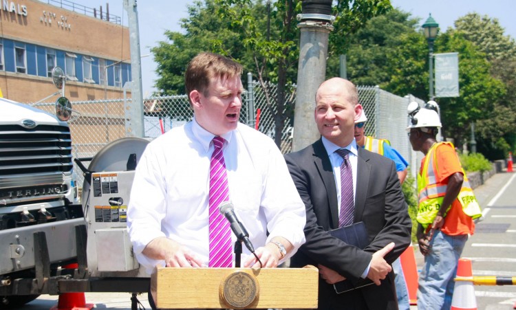 Carter Strickland Jr., (L), the city's Department of Environmental Protection commissioner