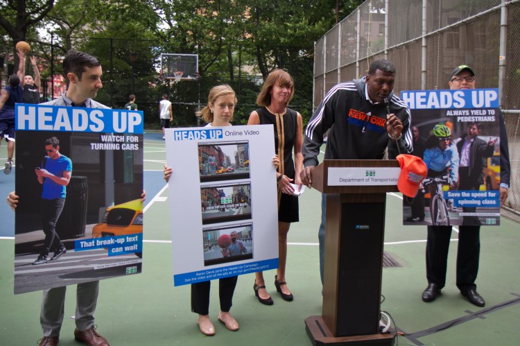 Former NBA star Larry Johnson speaks at a press conference with Commissioner Sadik-Khan