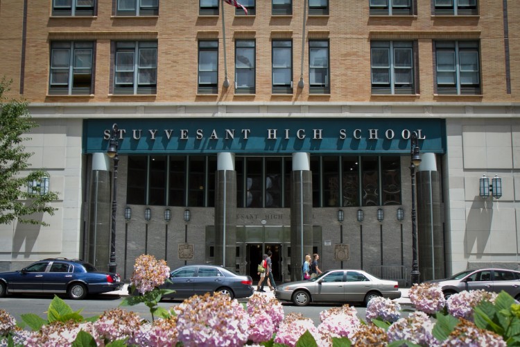 20120626_Stuyvesant High School_Chasteen_IMG_7833 Students walk past the Stuyvesant High School, Tuesday in Manhattan, where a student was allegedly caught taking pictures of three Regents exams on his smartphone to give to other students. (Benjamin Chasteen/The Epoch Times)
