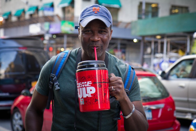 Eric Moor from Staten Island drinks an Extreme Gulp from 7-Eleven filled with Gatorade to protest Mayor Bloomberg's soda ban in Manhattan. (Benjamin Chasteen/The Epoch Times)