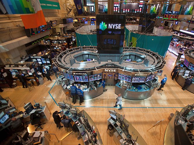 Traders work on the floor of the New York Stock Exchange