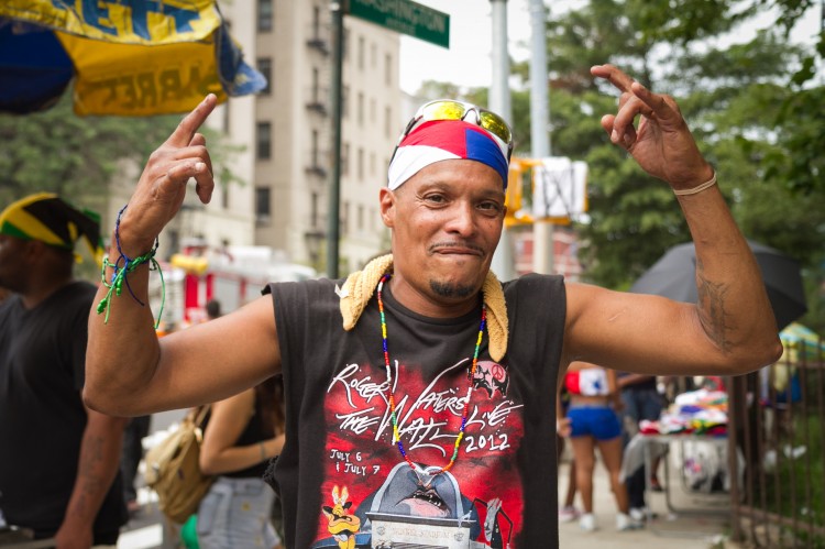 Wilfiedo Giboyeaus dances to music at New York's West Indian Day Carnival in Brooklyn, Sept. 3. (Benjamin Chasteen/The Epoch Times)