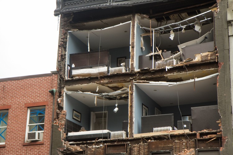 The facade of a building in the Chelsea area of Manhattan is revealed after Hurricane Sandy ripped through the area on Oct. 30. (Benjamin Chasteen/The Epoch Times)