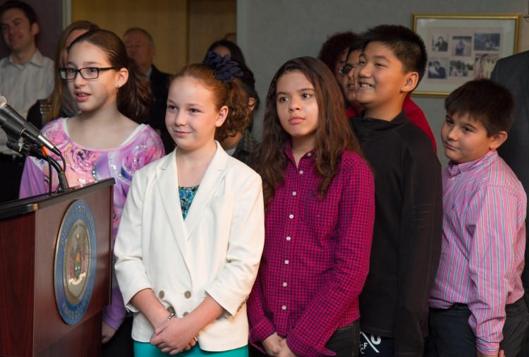  (L-R) Kristen Valdes, Fiona Kocillari, Anaiah Rivera, John Ting and Andres Felipe Valle watch the anti-bullying video they made before being presented with their awards for winning the DA's 2012 anti-bullying video contest on November 20 in Brooklyn, New York City. (Benjamin Chasteen/The Epoch Times) 