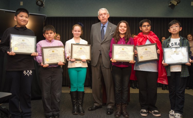 Kings county district attorney Charles J. Hynes with the winners of the DA's 2012 anti-bullying video contest on Nov. 20 in Brooklyn, New York City. Students from P.S. 186 in Bensonhurst, (L-R) John Ting, Andres Felipe Valle, Fiona Kocillari, Anaiah Rivera, Mohammad Rashid (as Super Nice Guy), and Willis Tran, were in fourth and fifth grades when they made their videos. (Benjamin Chasteen/The Epoch Times)