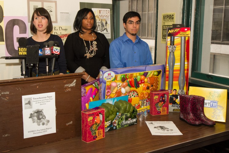  Members of The New York Public Interest Group Megan Ahearn (L), Courtney Ross (C), and Armando Chapelliquen (R), speak about potentially unsafe toys in Lower Manhattan on Dec. 5, 2012. (Benjamin Chasteen/The Epoch Times) 