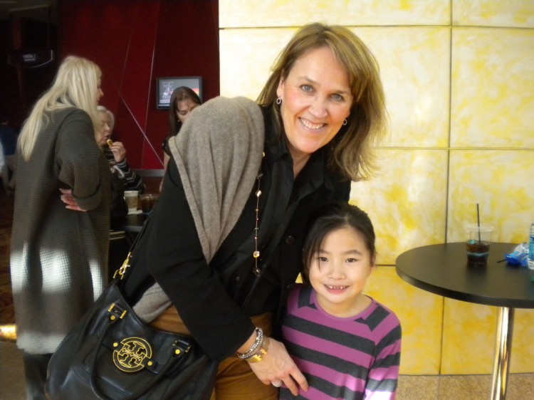 Mrs. Stephanie Ford and her daughter enjoy Shen Yun Performing Arts at the Cobb Energy Centre in Atlanta on Jan. 6. (Mary Silver/The Epoch Times)