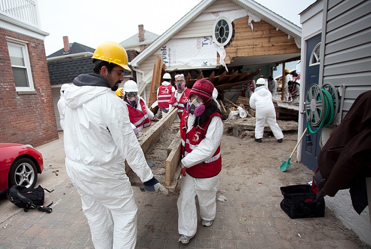 Volunteers help clean up John Twoomey's home in the Rockaways from Hurricane Sandy damage in mid-Jan. (Samira Bouaou/The Epoch Times)