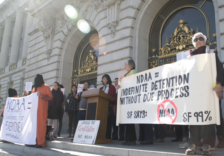 Members of civil rights groups speak out at a rally.