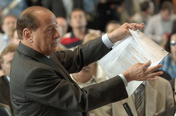 Italian Prime Minister Silvio Berlusconi addresses a courtroom on June 17, 2003 in Milan, Italy. Berlusconi was in tribunal to defend himself against corruption charges linked to his media company.  (Giuseppe Cacace/Getty Images)