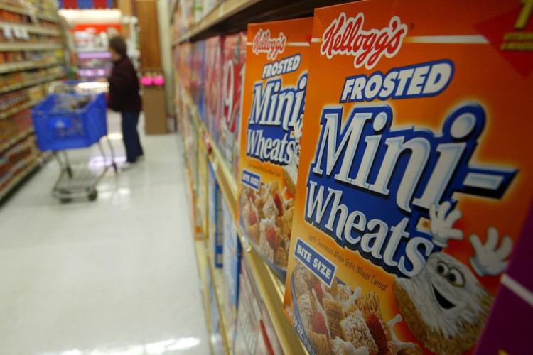 Kellogg's cereal are seen on the shelf at a grocery store in San Francisco. Kellogg Co. announced that its third-quarter earnings fell around 6 percent on weaker sales of its cereals worldwide. (Justin Sullivan/Getty Images)