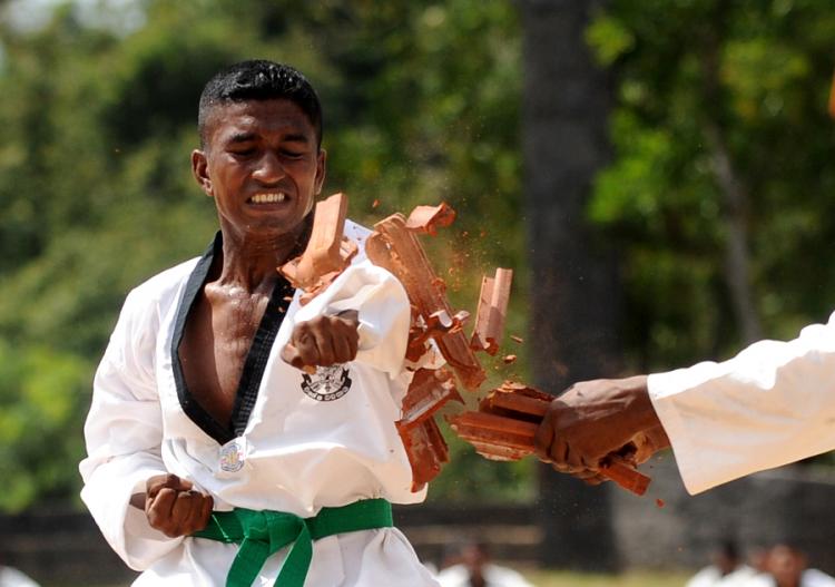 MARTIAL ARTS: Positioning the body and using the muscles correctly is crucial to using the body's energies well. (Ishara S. Kodikara/AFP/Getty Images)