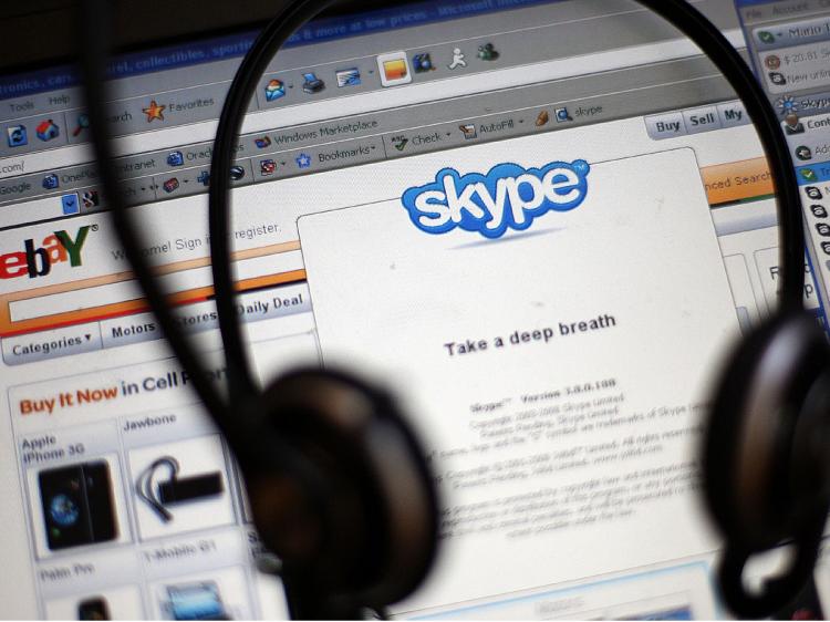 Ebay announced it will sell most of its Skype online phone service to a group of investors for $1.9 billion cash plus a $125 note. (Mario Tama/Getty Images)