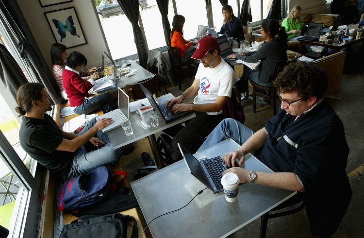 Customers at a cafe in San Francisco take advantage of free wi-fi, in this file photo. Last week a hearing was opened in congress for a bill that would require that all public places that offer Internet services to collect records that would tie IP addresses to individual users. (Justin Sullivan/Getty Images)