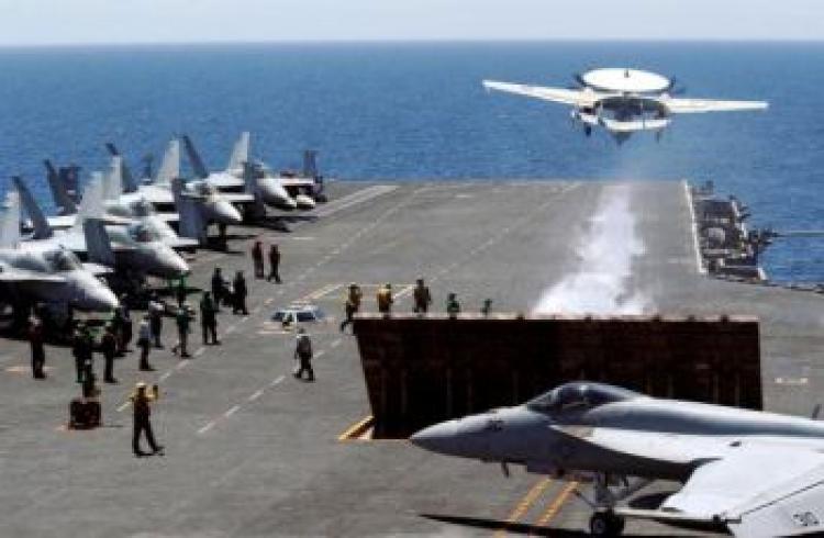 A U.S. fighter takes off from the flight deck of USS George Washington during a joint military exercises at east sea on July 26, 2010 in South Korea.  (Song Kyung-Seok-pool/Getty Images)