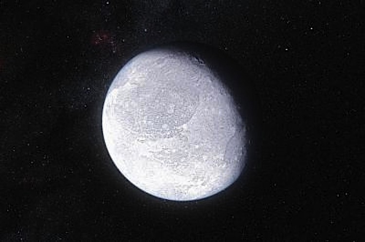Artist's impression of the distant dwarf planet Eris. New observations show that Eris is smaller than previously thought and almost exactly the same size as Pluto. (ESO/L. Calcada)