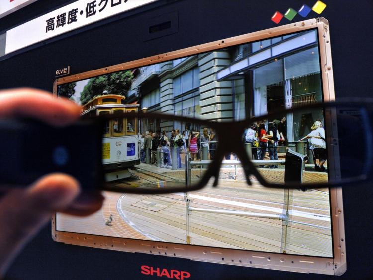 3D TV Competition: A person holds up special 3D glasses in front of the new 3D LCD panel for 60-inch-sized televisions unveiled by Japanese electronics company Sharp in Tokyo on April 12, 2010.  (Yoshikazu Tsuno/AFP/Getty Images)