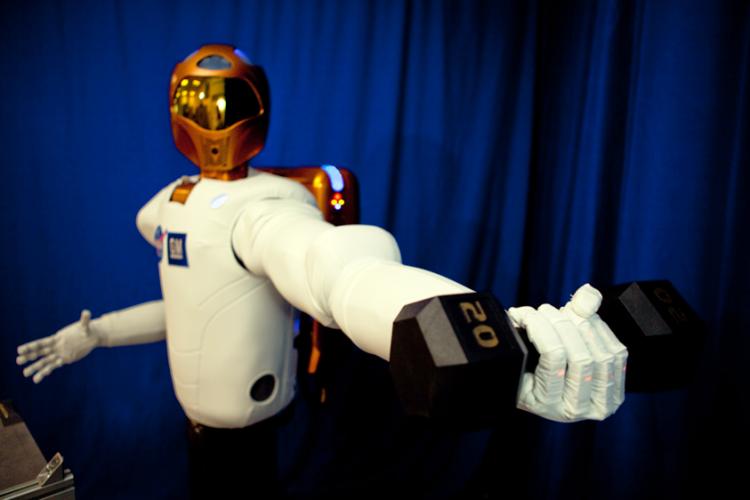 R2: According to NASA's website, R2 surpasses previous dexterous humanoid robots in strength, yet is safe enough to work side-by-side with humans. It is able to lift, not just hold, this 20-pound weight (about four times heavier than what other dexterous robots can handle) both near and away from its body. (Courtesy of NASA.gov)