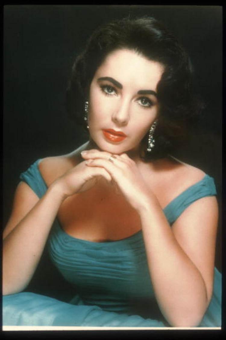 Actress Elizabeth Taylor poses in an old film still. Ms. Taylor died Wednesday in Los Angeles at age 79. (Getty Images)