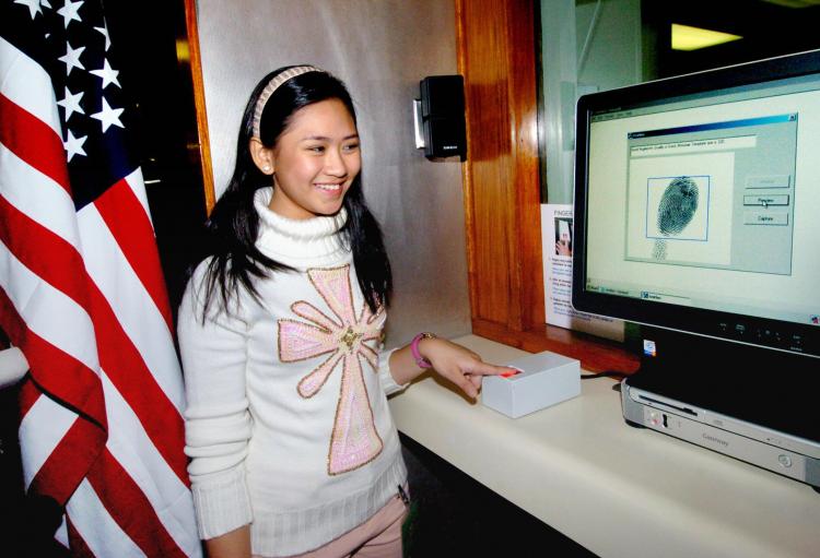 A Philippine singer gets her work visa at the U.S. embassy in Manila. (JAY DIRECTO/AFP)
