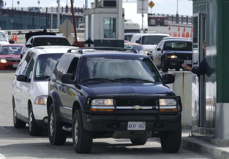 Vehicles stop at a border checkpoint in Detroit after crossing Ambassador Bridge which connects Detroit, Mich. and Windsor, Ont. With layers of new regulations and inspections often leading to long wait times, the Canadian Chamber of Commerce is calling f (Jeff Kowalsky/AFP/Getty Images)