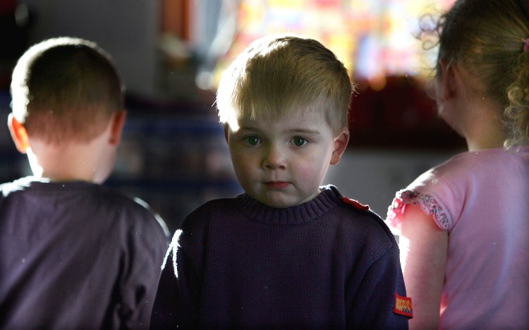 Picture of a three-year-old boy attending a private nursery school January 28, 2005 in Glasgow, Scotland. (Christopher Furlong/Getty Images)