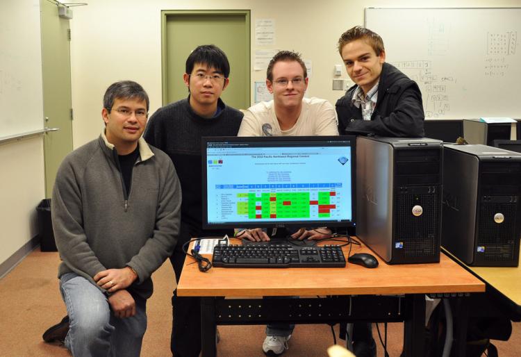(L-R) Instructor Brad Bart and his Battle of the Brains team: Hua Huang, Wesley May, and Andrew Henrey. This month's finals in the International Collegiate Programming Contest will be relocated due to the unrest in Egypt. (Simon Fraser University)