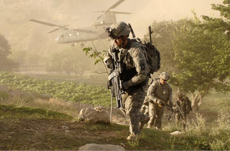 BOOTS ON THE GROUND: Soldiers from A Company, 101st Airborne Division, Special Troop Battalion air assault into a village inside Jowlzak Valley, Parwan Province, Afghanistan. Following the death of al-Qaeda leader Osama bin Laden, the United States is considering an early withdrawal from the country.(Courtesy of U.S. Army)