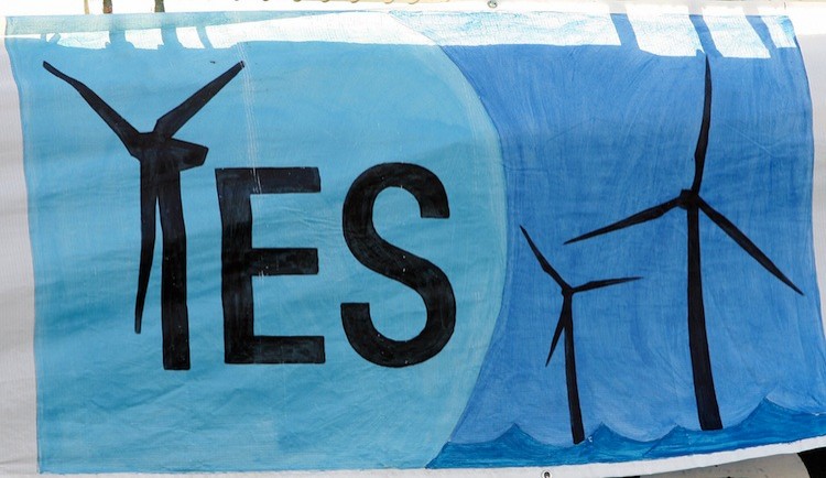 A pro-wind power banner on the side of the Greenpeace ship Arctic Sunrise as it is docked on the west side of Manhattan, Oct. 1, 2005. (Don Emmert/AFP/Getty Images)