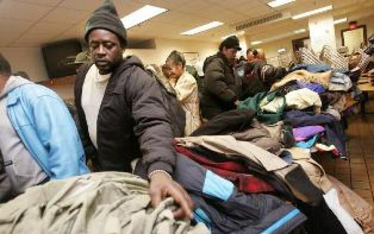 New York Mayor hands out coats to the poor. (Mario Tama/Getty Images)