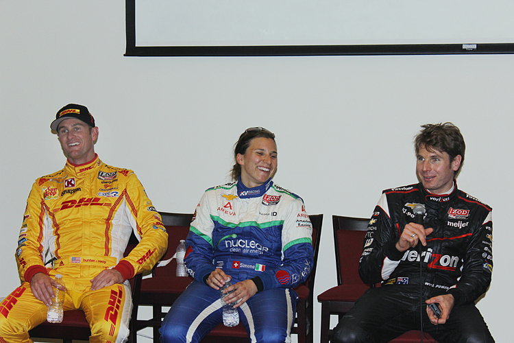 Ryan Hunter-Reay, Simona di Silvestro, and Will Power share a laugh as they discuss the first practice sessions of the 2013 IndyCar season. (James Fish/The Epoch Times)