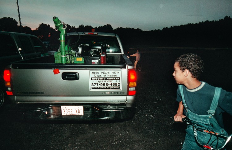 Vinny Damilo of Staten Island looks over a mosquito sprayer in this file photo from 2000 on Staten Island, N.Y. The Health Department has been spraying throughout the city as the mosquito population grows and West Nile Virus becomes more prevalent. (Chris Hondros/Newsmakers) 