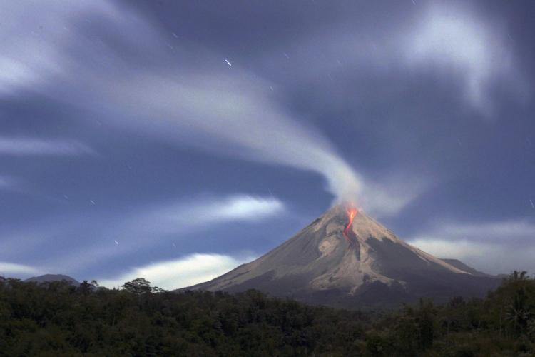 Mount Merapi spewing smoke and ash in 2006. The volcano is also known as Fire Mountain. (Dimas Ardian/Getty Images)