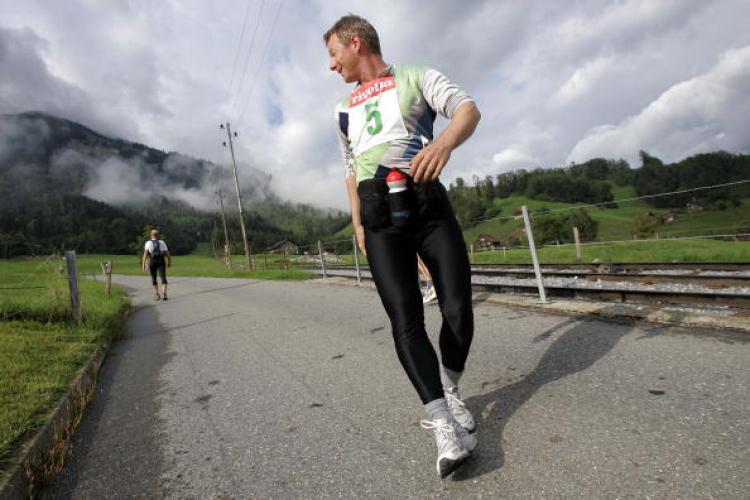 RUNNING BACKWARD: Runners compete during the first ever long distance running backwards up a mountain race, in Stans, central Switzerland in 2006.  (Fabrice Cofrini/Getty Images)