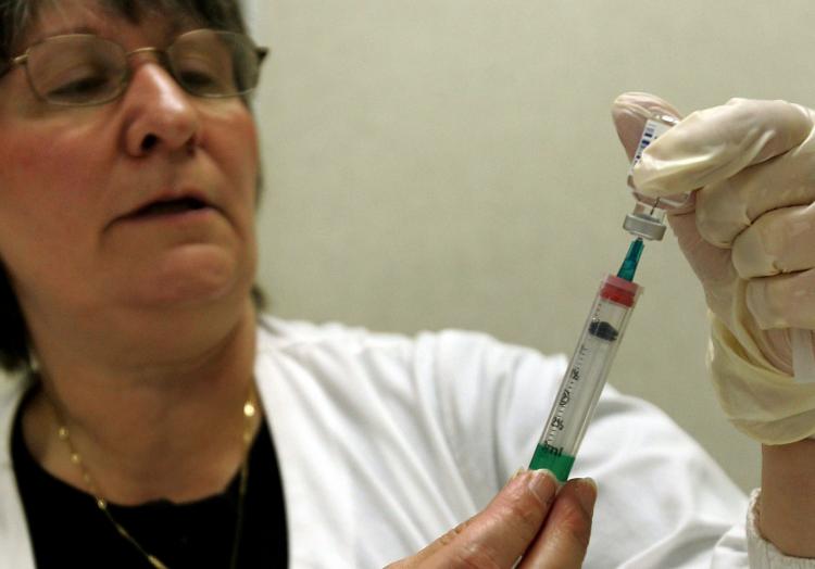Multi-dose injection vials contain thimerosal as a preservative. (Tim Boyle/Getty Images)